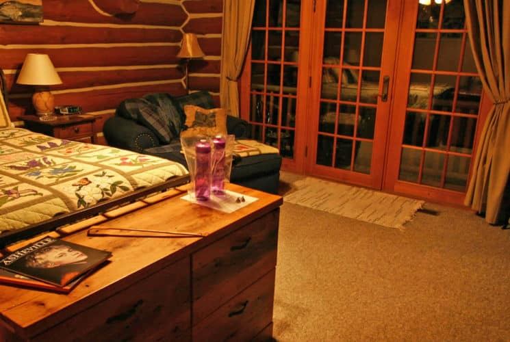 Blueberry Room at Wildberry Lodge, queen iron bed and electric fireplace